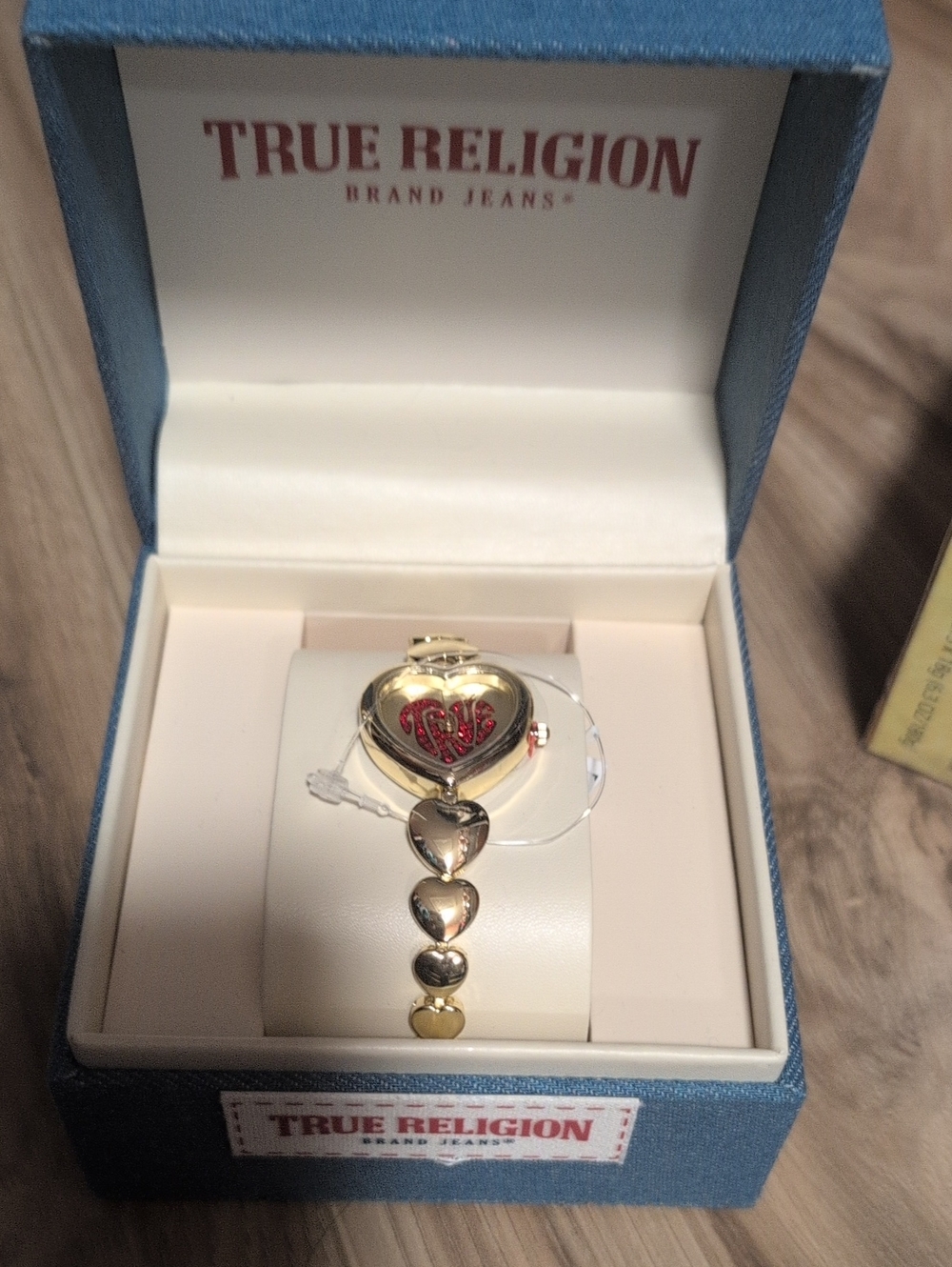 True Religion Gold Heart Bracelet Watch with Red Enamel Detail